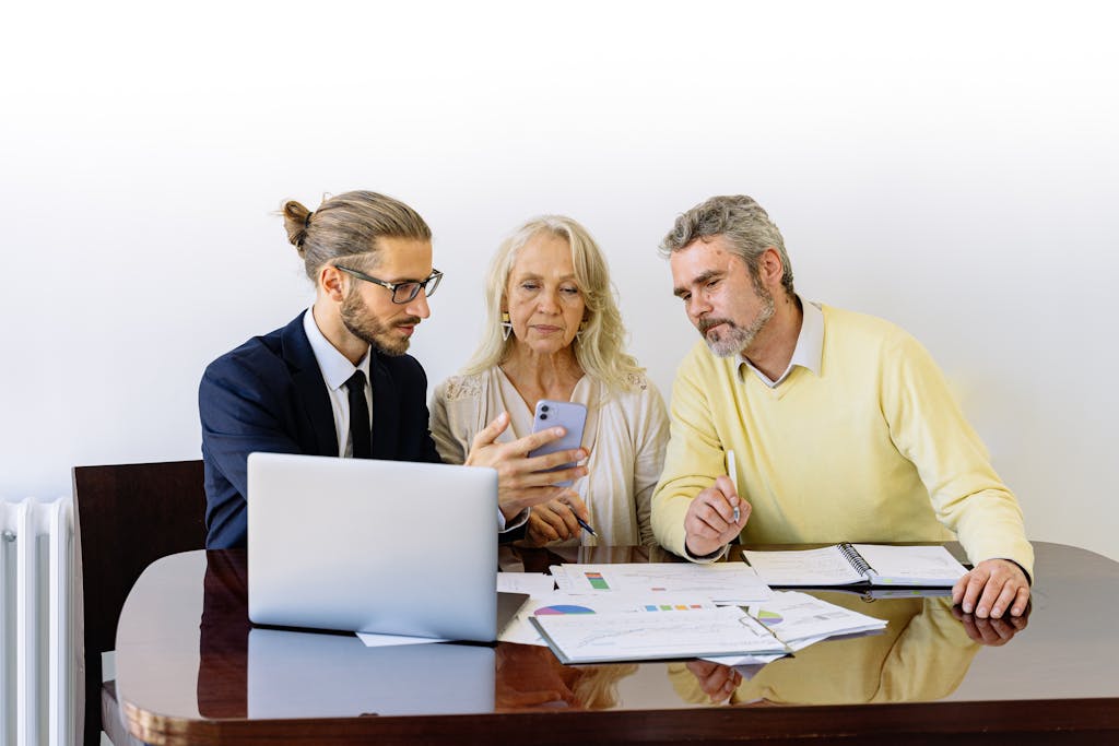 Dog and cat sitting beside owner reviewing 2025 pet insurance cost chart”
